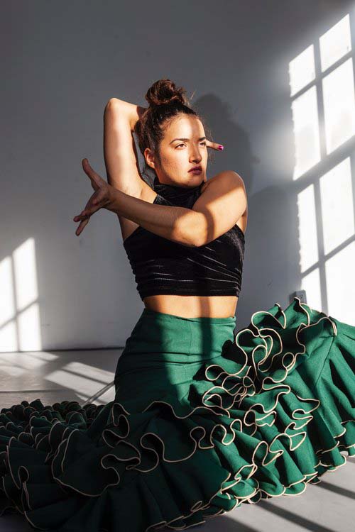 Sofí Gudiño posing in green dress