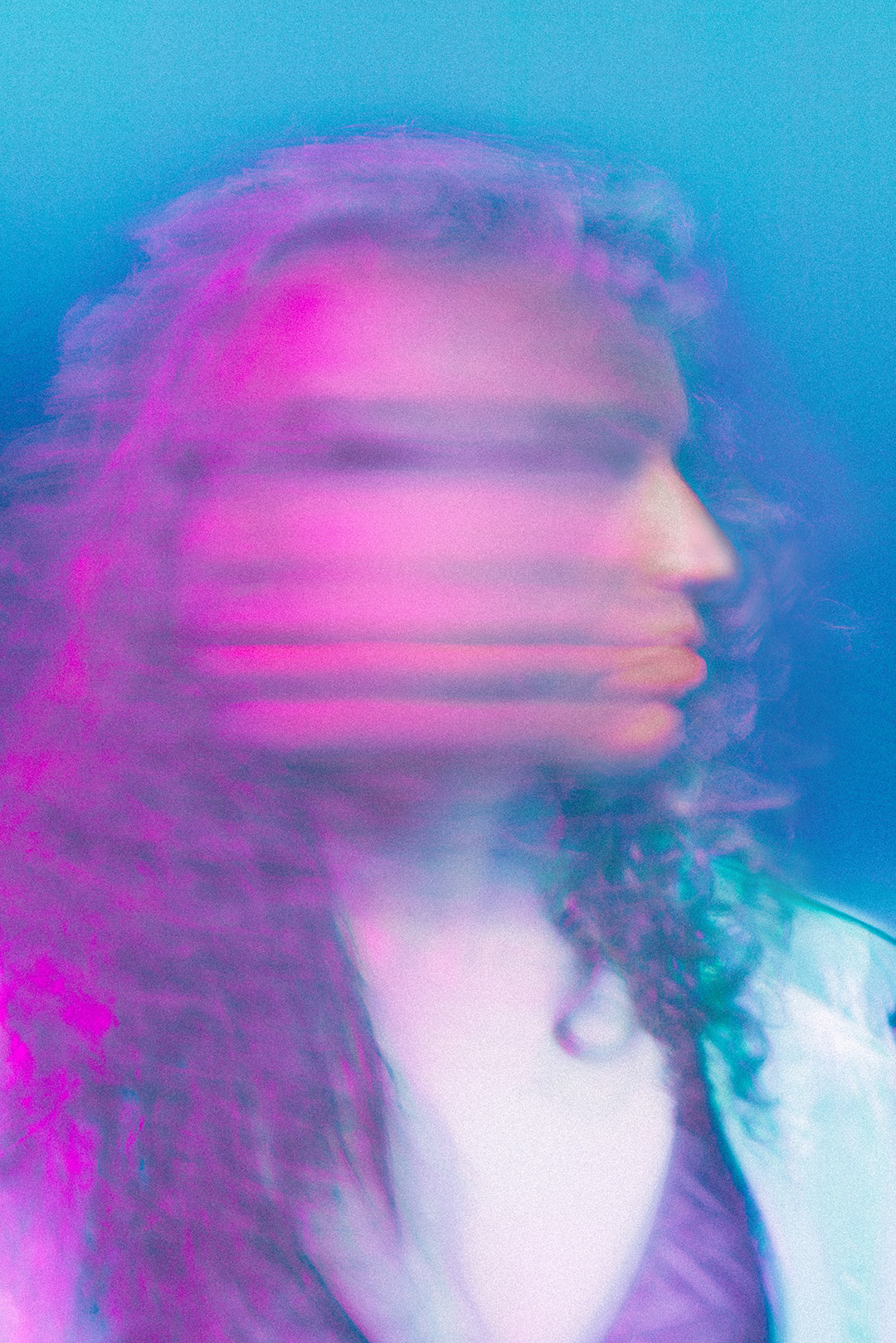 Woman's face blurred with colors