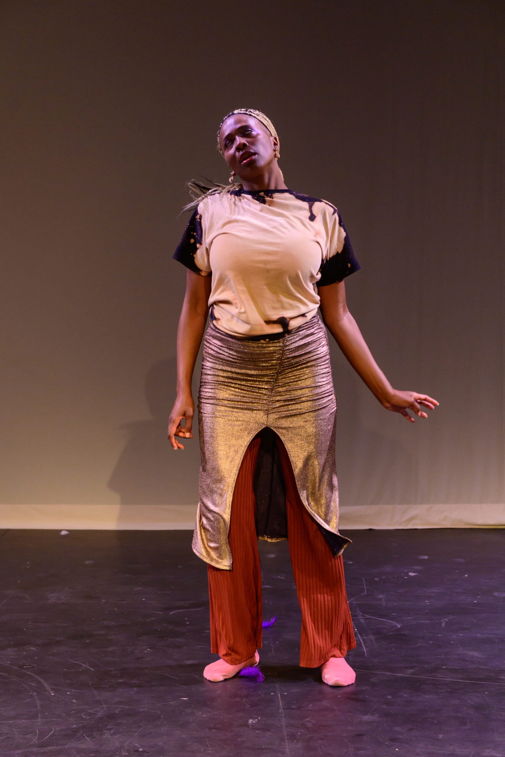 Artist Aisha Sasha John in performance piece portrait.